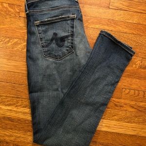 Light-medium blue distressed AG skinny ankle jeans